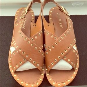 Tan and gold flats